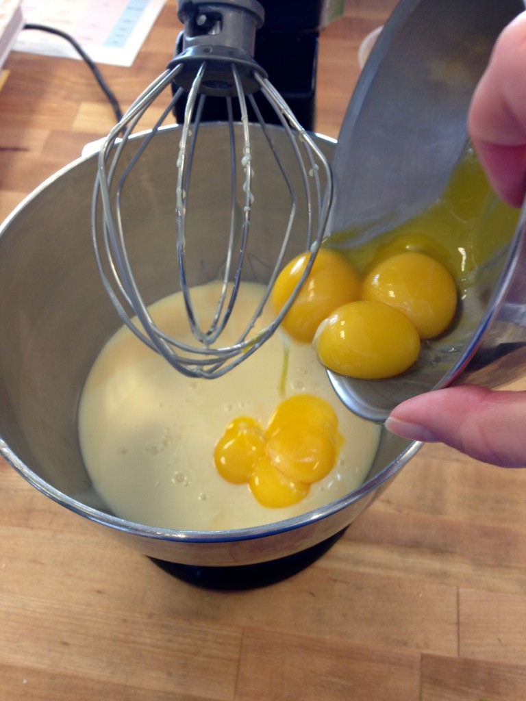 Start the Easy Key Lime Pie Recipe by whisking together the sweetened condensed milk and yolks.  #KeyLimePie #Easy #Recipe