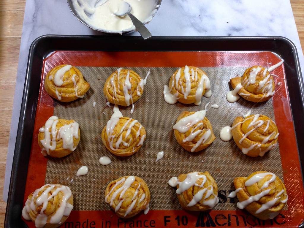 Pumpkin Cheesecake Crescent Roll Rounds are finished with a simple cream cheese glaze #pumpkin #cheesecake #fall #baking 