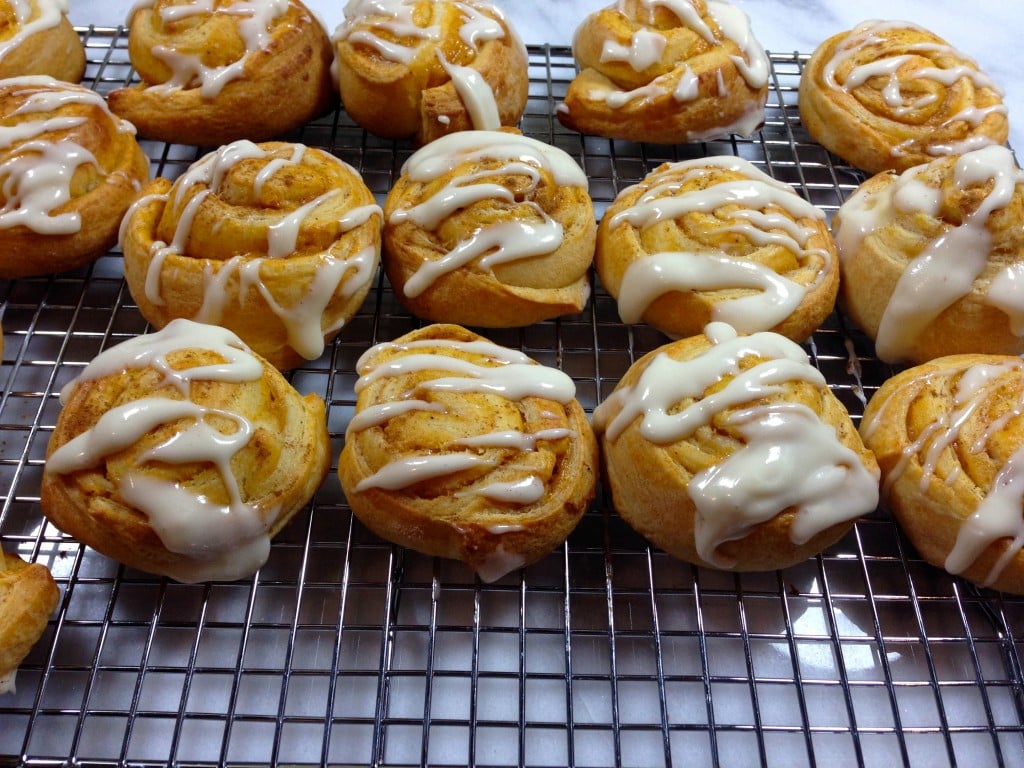 Pumpkin Cheesecake Crescent Roll Rounds are simple to make. Just unroll the dough, fill with pumpkin filling, chill, bake, and glaze. #pumpkin #cheesecake #fall #baking