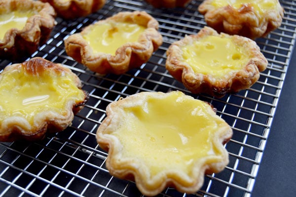 Hong Kong Egg Tarts - a popular pastry in China, Taiwan, Macau, Hong Kong and at dim sum restaurants. An easy and delicious taste of Asia! | www.thehungrytravelerblog.com