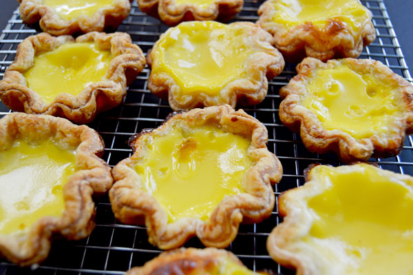 Hong Kong Egg Tarts - a popular pastry in China, Taiwan, Macau, Hong Kong and at dim sum restaurants. An easy and delicious taste of Asia! | www.thehungrytravelerblog.com