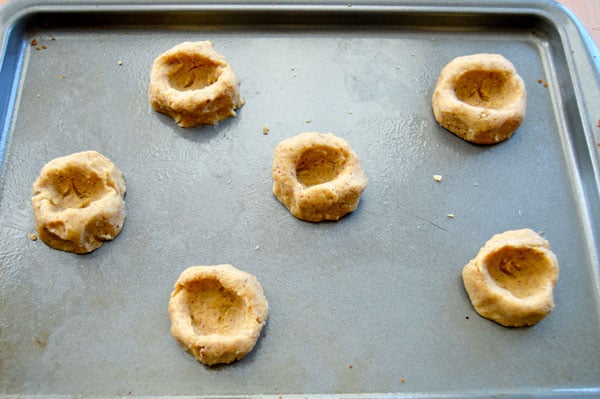 Kentucky Derby Cookies - pecan shortbread thumbprints filled with pecans, bourbon, and chocolate. A fun take on the traditional Derby Pie. Perfect for parties! | www.thehungrytravelerblog.com