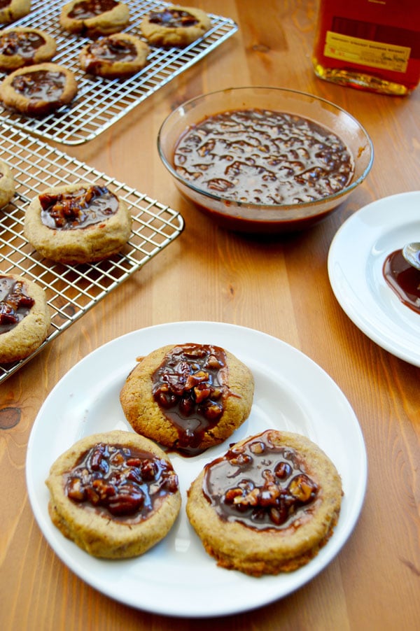 Kentucky Derby Cookies - pecan shortbread thumbprints filled with pecans, bourbon, and chocolate. A fun take on the traditional Derby Pie. Perfect for parties! | www.thehungrytravelerblog.com