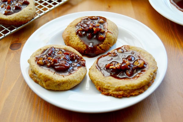 Kentucky Derby Cookies - pecan shortbread thumbprints filled with pecans, bourbon, and chocolate. A fun take on the traditional Derby Pie. Perfect for parties! | www.thehungrytravelerblog.com