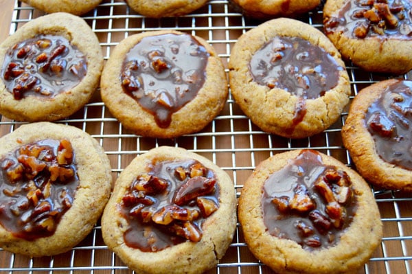 Kentucky Derby Cookies - pecan shortbread thumbprints filled with pecans, bourbon, and chocolate. A fun take on the traditional Derby Pie. Perfect for parties! | www.thehungrytravelerblog.com