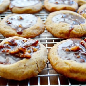 Kentucky Derby Cookies - pecan shortbread thumbprints filled with pecans, bourbon, and chocolate. A fun take on the traditional Derby Pie. Perfect for parties! | www.thehungrytravelerblog.com