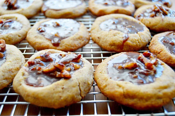 Kentucky Derby Cookies - pecan shortbread thumbprints filled with pecans, bourbon, and chocolate. A fun take on the traditional Derby Pie. Perfect for parties! | www.thehungrytravelerblog.com