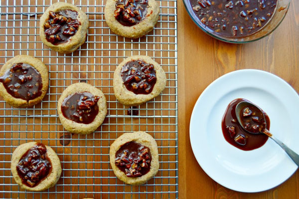 Kentucky Derby Cookies - pecan shortbread thumbprints filled with pecans, bourbon, and chocolate. A fun take on the traditional Derby Pie. Perfect for parties! | www.thehungrytravelerblog.com