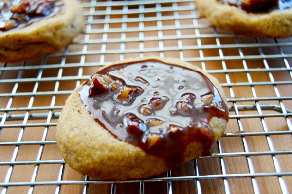 Kentucky Derby Cookies - pecan shortbread thumbprints filled with pecans, bourbon, and chocolate. A fun take on the traditional Derby Pie. Perfect for parties! | www.thehungrytravelerblog.com