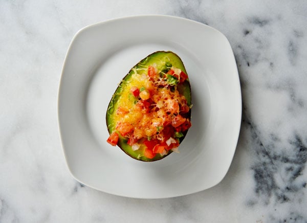 Baked Avocado - Take an avocado, filled it with pico de gallo, top it with shredded cheese and baked until melty and warm. Delicious and healthy! 