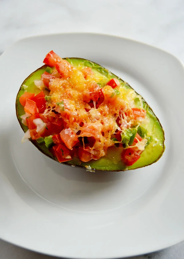 Baked Avocado - Take an avocado, filled it with pico de gallo, top it with shredded cheese and baked until melty and warm. Delicious and healthy!