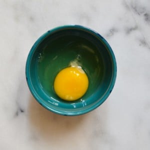 Tips for Better Baking - Crack eggs into a dark bowl to easily spot pieces of shell | www.thehungrytravelerblog.com