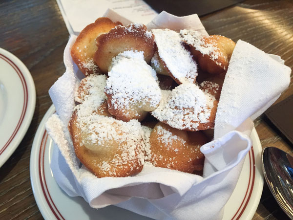 French Madeleines - the classic French tea cake with brown butter, lemon zest, vanilla, and a touch of honey. | www.thehungrytravelerblog.com