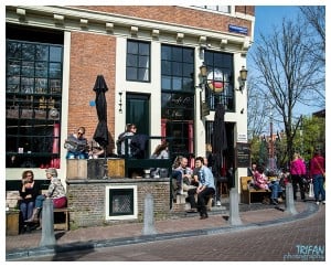 Enjoying a sunny day on the patio at Cafe Papeneiland | Eating Amsterdam Food Tour - Jordaan Food and Canals Tour