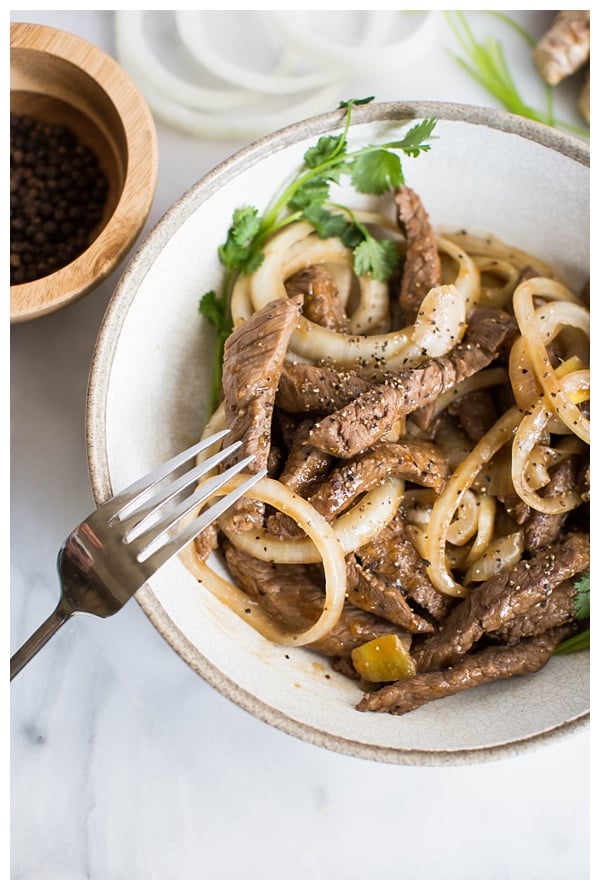 Stir-Fried Beef with Black Pepper is an easy stir-fry made with coarsely cracked black pepper, onions, and oyster sauce. Serve with rice and a cucumber salad for wonderful authentic Chinese meal! 