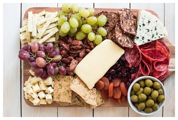 Nothing compares to a great cheese board! Learn how to make a cheese board -- from choosing cheeses & picking accompaniments to composing it all on a board! 