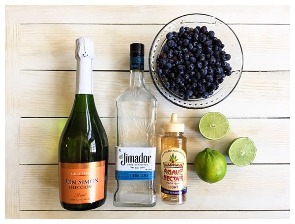 Sparkling Blueberry Lime Tequila Punch is a festive cocktail to serve at any holiday party. With only 5 ingredients, mix up a big batch and enjoy the party!