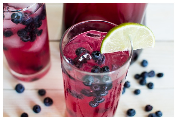 Sparkling Blueberry Lime Tequila Punch is a festive cocktail to serve at any holiday party. With only 5 ingredients, mix up a big batch and enjoy the party!