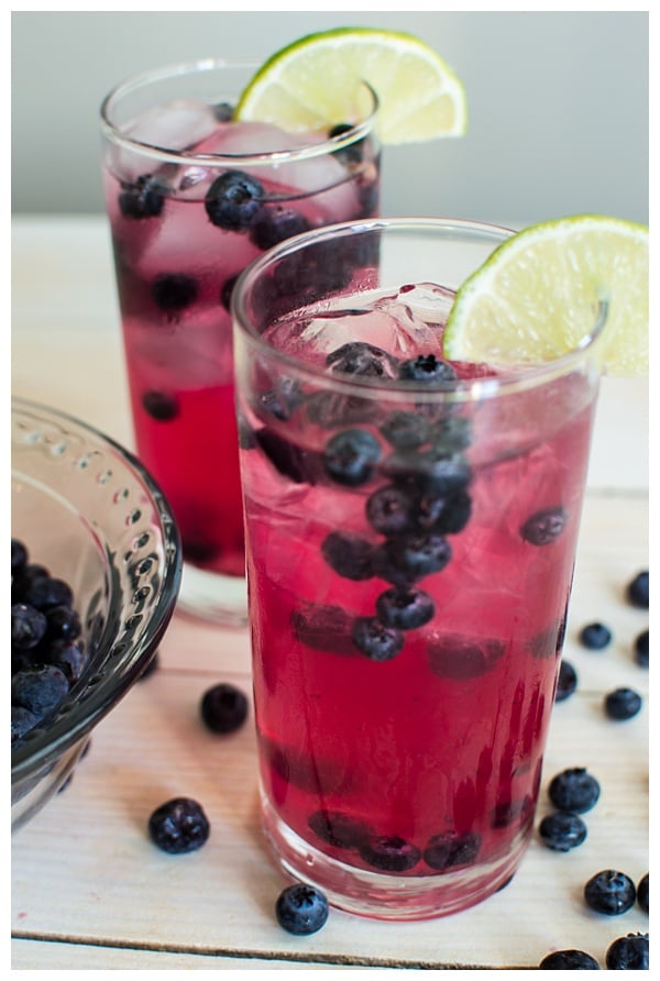 Sparkling Blueberry Lime Tequila Punch is a festive cocktail to serve at any holiday party. With only 5 ingredients, mix up a big batch and enjoy the party!