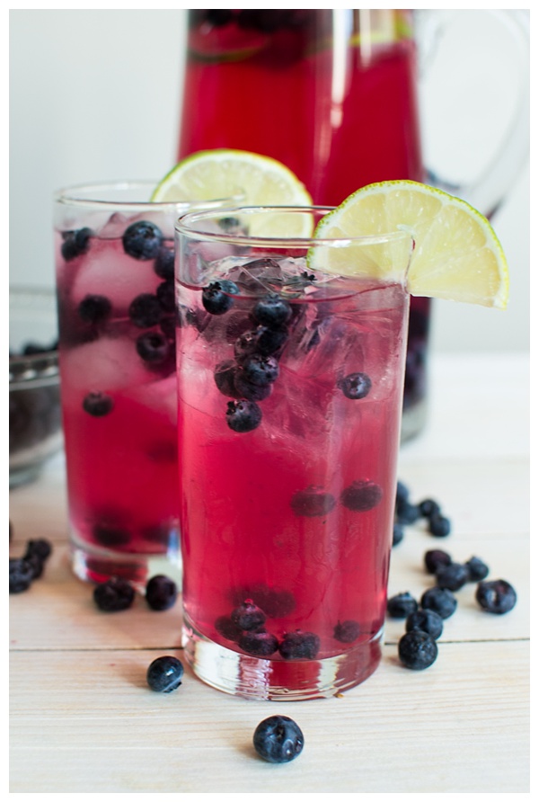 Sparkling Blueberry Lime Tequila Punch is a festive cocktail to serve at any holiday party. With only 5 ingredients, mix up a big batch and enjoy the party!