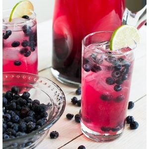 Sparkling Blueberry Lime Tequila Punch is a festive cocktail to serve at any holiday party. With only 5 ingredients, mix up a big batch and enjoy the party!