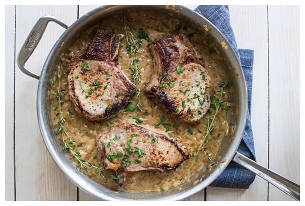 Apple Cider Marinated Pork Chops with Apple Pan Sauce -- Pork chops marinated in apple cider, seared and roasted & finished with a creamy apple pan sauce.