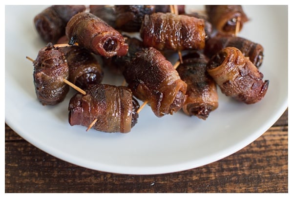 Bacon-Wrapped Dates -- Dates are stuffed with Manchego cheese and slivered almonds, then wrapped in bacon and drizzled with honey. Perfect party appetizer! 