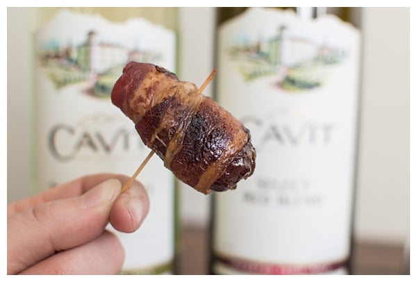 Bacon-Wrapped Dates -- Dates are stuffed with Manchego cheese and slivered almonds, then wrapped in bacon and drizzled with honey. Perfect party appetizer! 