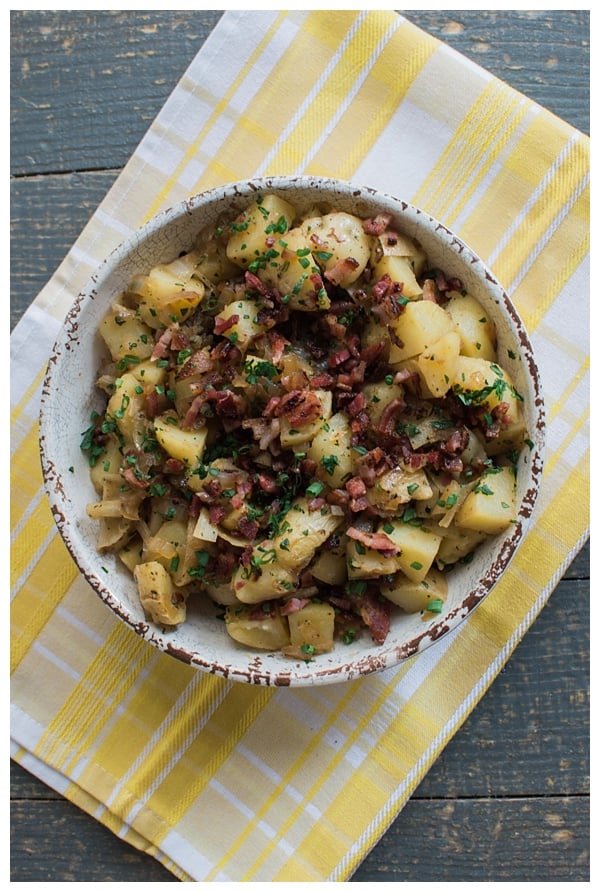 German Potato Salad is a sweet and sour potato salad with bacon, onion and fresh herbs. It's best served warm or at room temperature. 